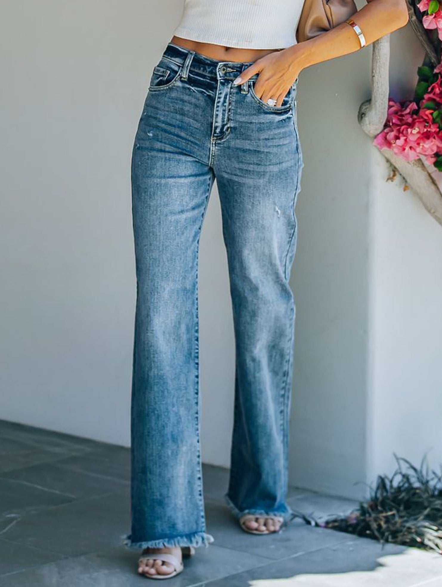 Raw-edge mid-rise slim-fit jeans