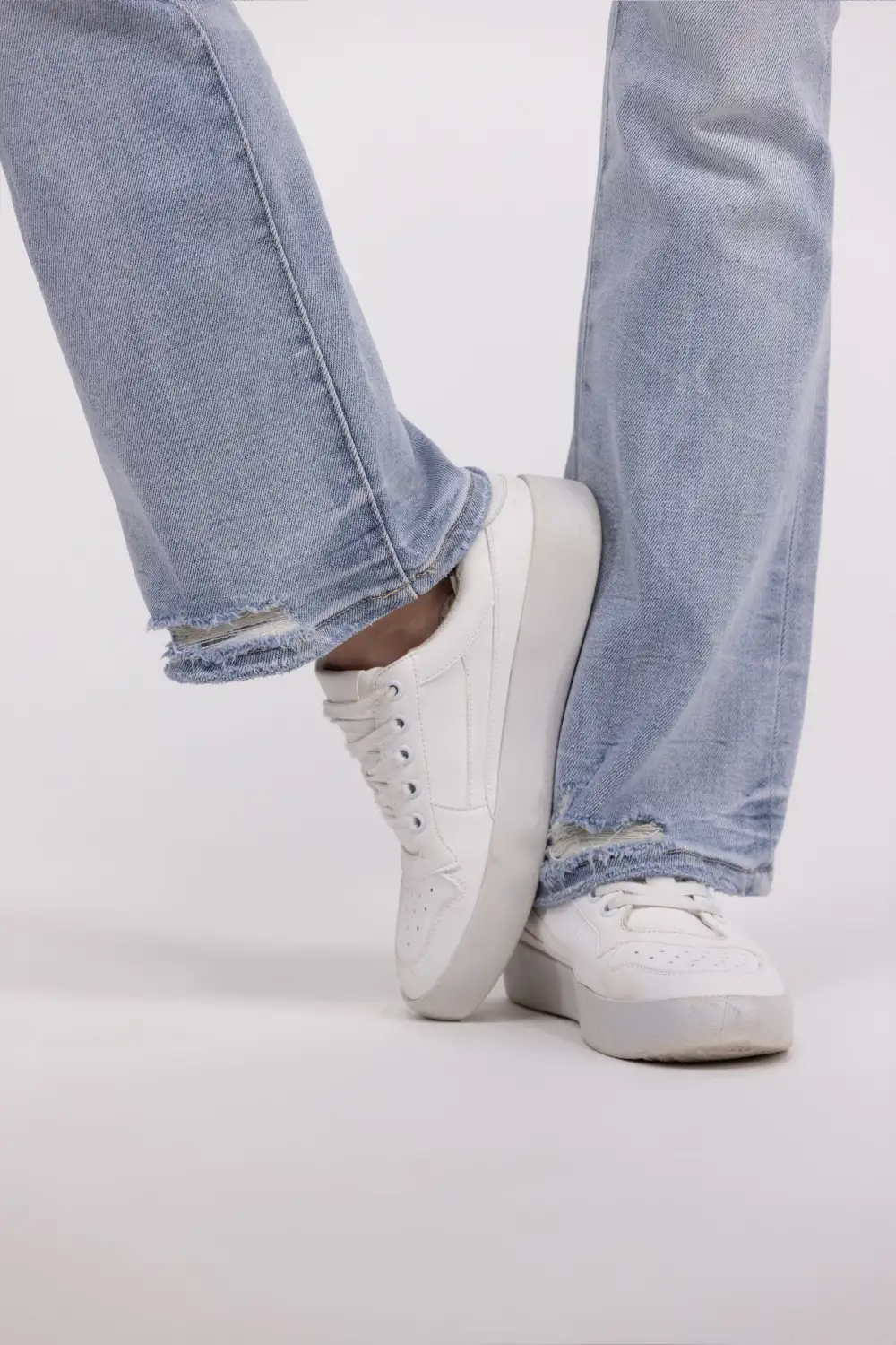 The Chelsea from Lovervet: Mid-Rise Tummy Control Distressed Bootcut Denim
